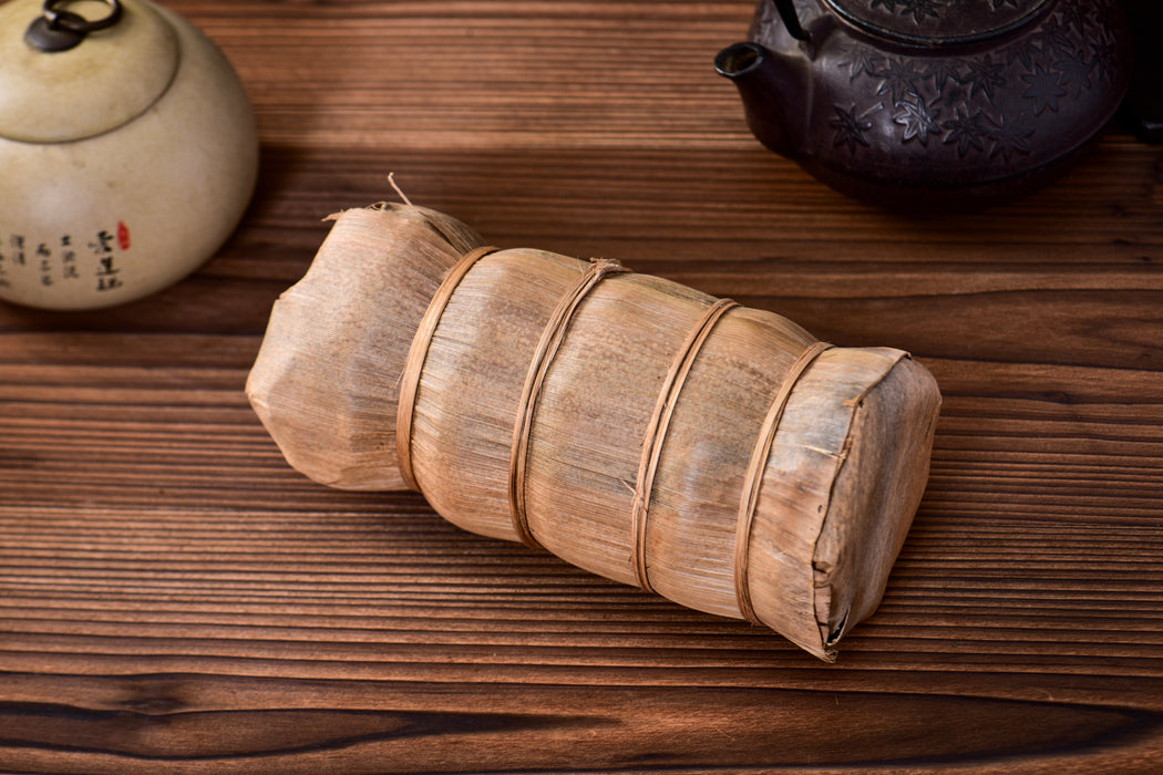 2003 Nan Jian Tu Lin "Bamboo Wrapped" Raw Pu-erh Tea Tuo | Yunnan Sourcing Tea Shop