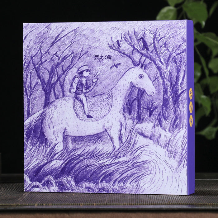 Purple box with a man on a horse illustration on a wooden surface with a tea cup and trees in the background.