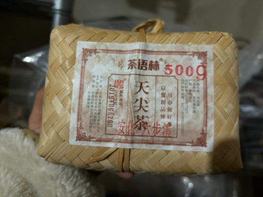 Woven basket with a label on a blurred background