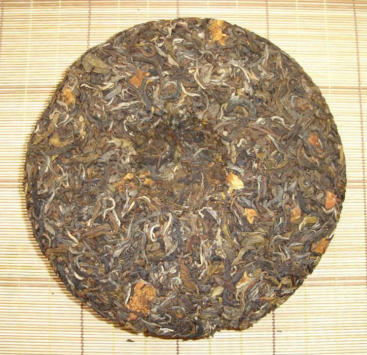 2004 Ron-Zhen * Camellia Flower and Raw Pu-erh Tea Cake