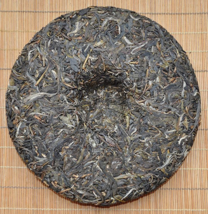 2010 Hai Lang Hao "Qi Lin Jun Xiu" Yi Wu Wild Arbor Raw Pu-erh Tea Cake - Yunnan Sourcing Tea Shop