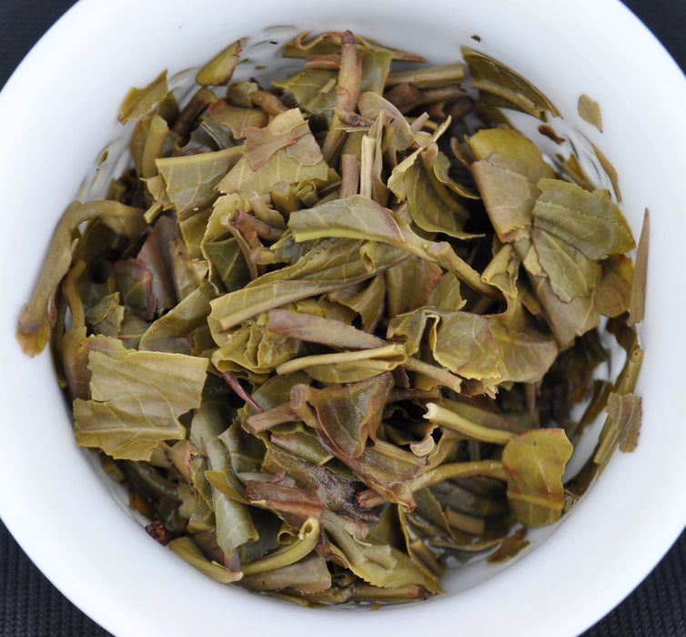 2015 Yunnan Sourcing Qing Mei Shan Old Arbor Pu-erh Tea Cake