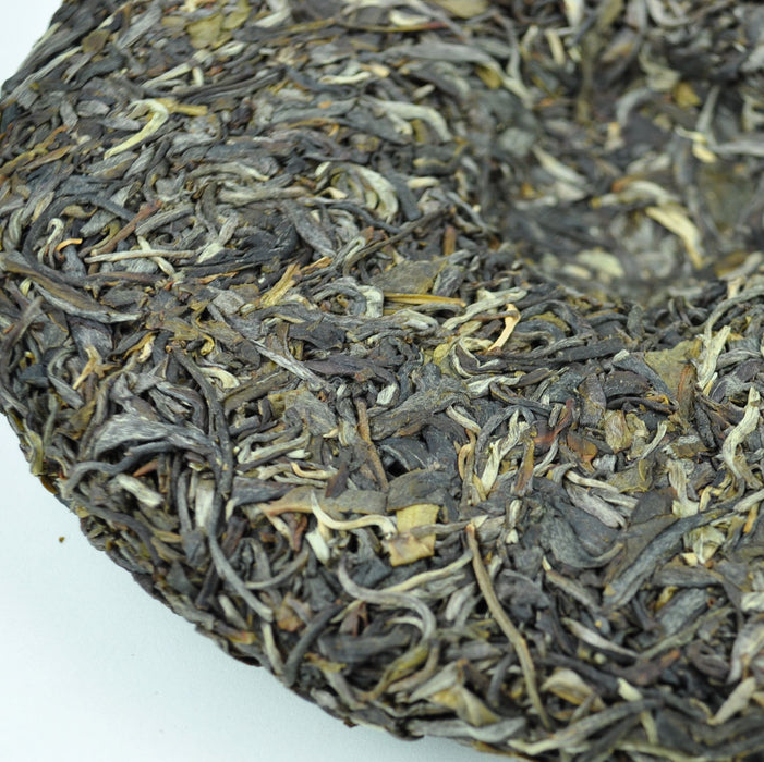 2016 Yunnan Sourcing Qing Mei Shan Old Arbor Raw Pu-erh Tea Cake