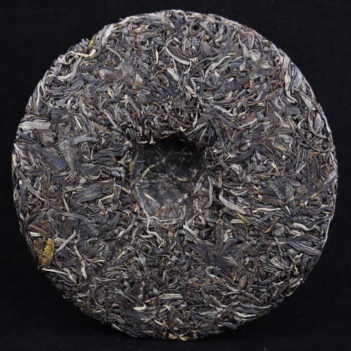 2014 Yunnan Sourcing Qing Mei Shan Old Arbor Pu-erh Tea Cake